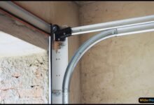 how to fix bent garage door track